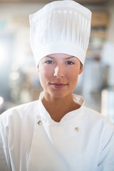 Portrait of confident female chef