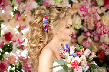 Obraz premium Wedding hairstyle a young girl. Bride. Woman with Flowers in her