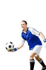 Woman goalkeeper throwing again the ball