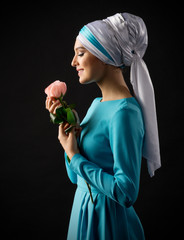 Young muslim girl with rose