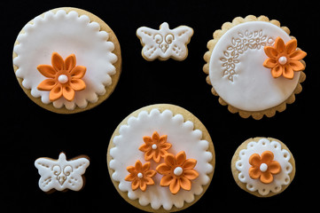 Homemade white butter cookies, decorated with orange flowers