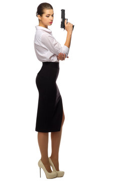 Young businesswoman with gun
