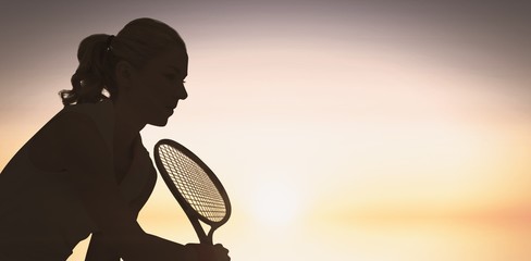 Composite image of athlete playing tennis with a racket  - Powered by Adobe