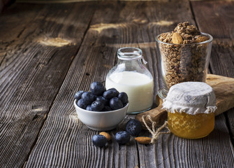 Healthy breakfast ingredients. Cereal, chocolate muesli, fresh blueberries