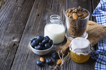 Healthy breakfast ingredients. Cereal, chocolate muesli, fresh blueberries