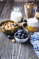 Healthy breakfast ingredients. Cereal, chocolate muesli, fresh blueberries