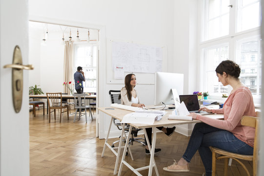 Creative professionals working in office