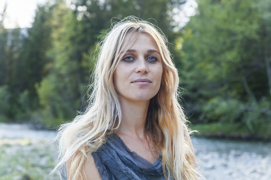Portrait of smiling blond woman in nature