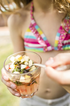 Girl with glass of homemade lemonade