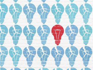 Finance concept: light bulb icon on wall background