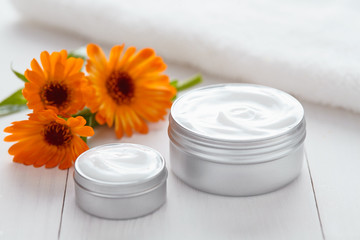 Skin cleansing cosmetic cream with calendula flowers vitamin spa lotion natural organic herbal moisturizer product. Medical dermatology anti aging, acne, blemish, pimple, blackhead clear treatment