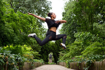 Fototapeta na wymiar jazz dancer making a jump outdoors