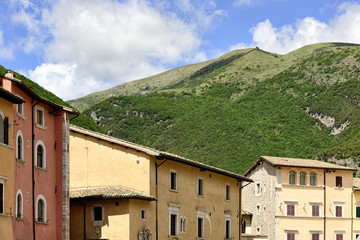 Houses and green hills in Italy