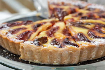 Freshly baked plum pie in organic bakery