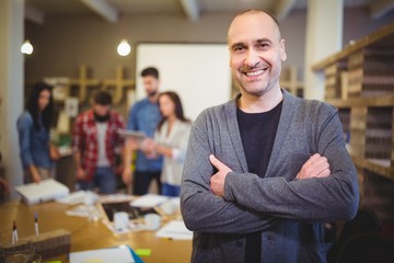 Fototapeta premium Confident businessman with arms crossed