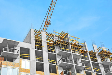 Crane and highrise construction site