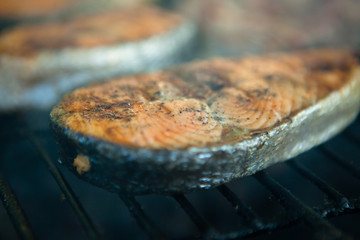 Grilled salmon steaks on the flaming.