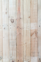 Fototapeta premium Grunge brown wood wall background with knots and nail holes