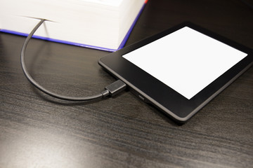 Electronic device for reading books (ereader, ebook), concept of downloading a book on the device