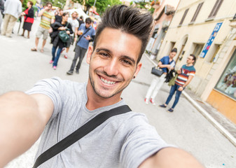 Handsome tourist taking a selfie