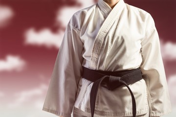 Composite image of mid section of karate player