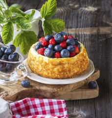 beautiful cheesecake with blueberries and strawberries