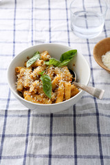 pasta with cheese and basil in bowl