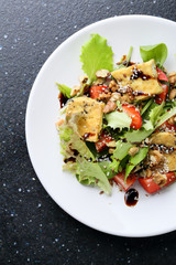 vegetarian salad with strawberry on white plate