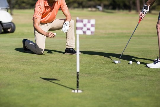 Cropped image of woman playing golf 
