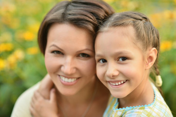 girl with mother in park