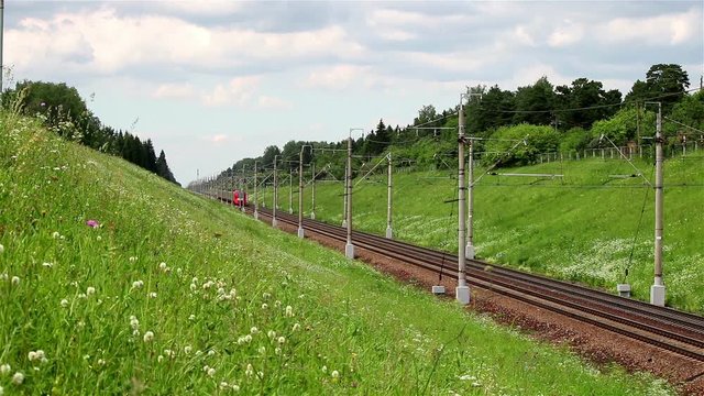 A timelapse of a passenger electric train Lastochka on a double-track railroad, Moscow, Russia, June 2016