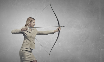 Woman aiming her goal . Mixed media