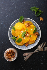 Fototapeta na wymiar fresh salad with orange and walnut