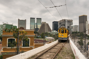 Iconic Santa Teresa tram is passing Carioca Aqueduct