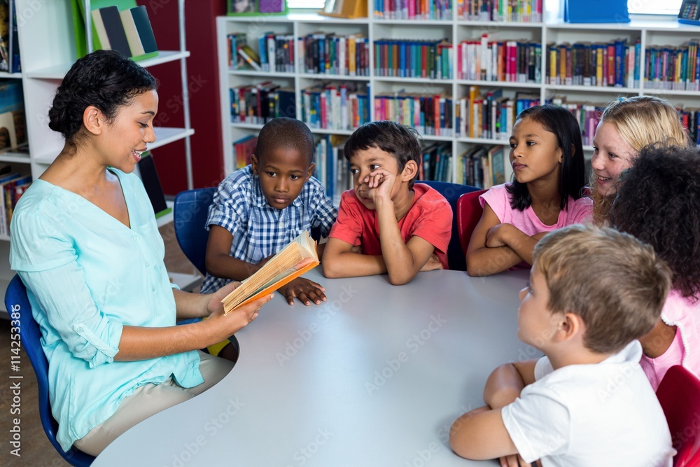 Sticker Teacher reading a book to mixed race children