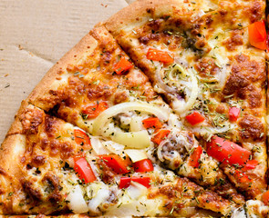 Italian pizza with sausage, red peppers and cheese mozzarella, onion, rosmary and basil