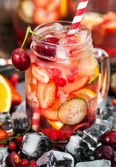 Healthy infused detox water with fresh berries and fruits
