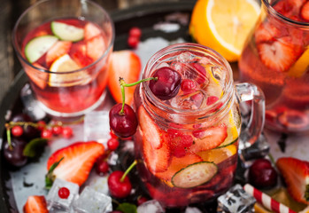 Healthy infused detox water with fresh berries and fruits