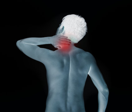Young man with neck pain, in shades of pale