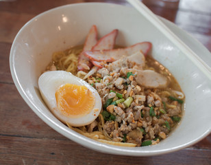 Spicy noodles with egg and pork ( Thai style food )