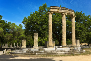 Fototapeta na wymiar Greece. Archaeological Site of Olympia. Ruins of the Philippeion (4rth century BC). The archaeological site of Olympia is on UNESCO World Heritage List since 1989
