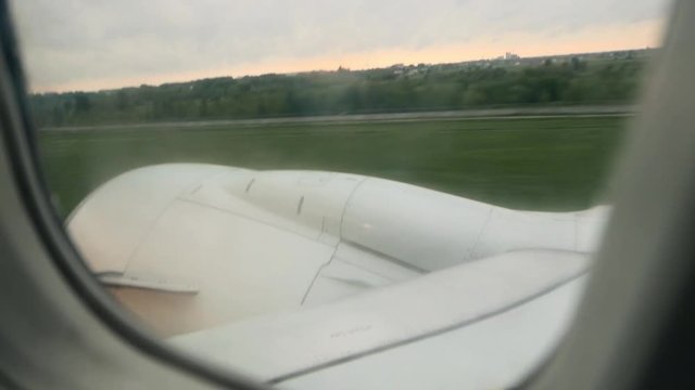 Takeoff of aircraft in rainy weather. Aerial survey