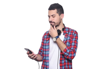 Young man listening to music with smartphone.