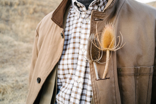 Cropped view of man with wildflower in buttonhole