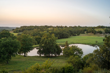 View of lake on lush green landscape