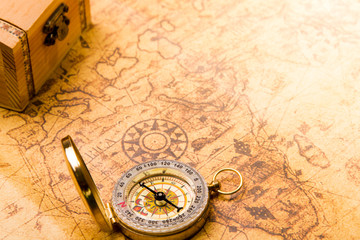 Fototapeta na wymiar Vintage compass and maps with small treasure chase