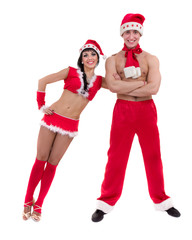 Happy young couple wearing santa claus clothes