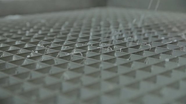 A device is being filled with polypropylene