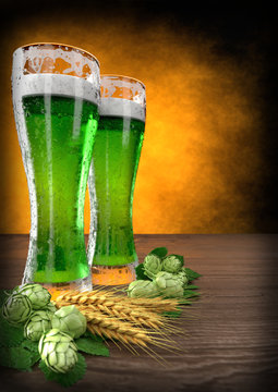 three glasses of green beer with barley and hops. 3D render