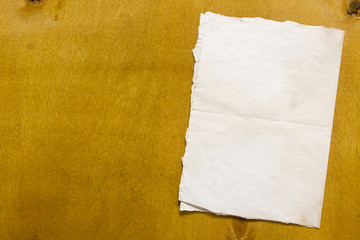 Grunge paper on wooden background